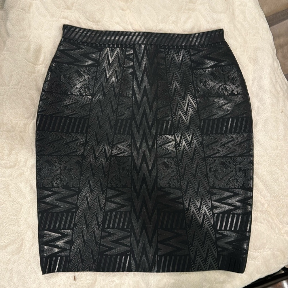 Black Bandage skirt with metallic design in mini length.